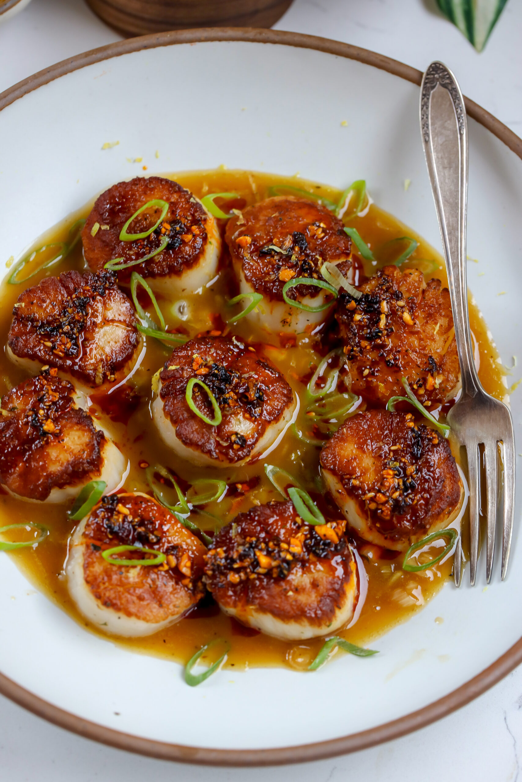 pan seared scallops covered in a dirty ginger beurre blanc sauce.