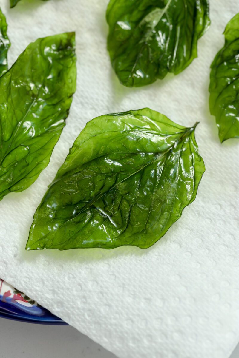 Freshly fried crispy basil glistening