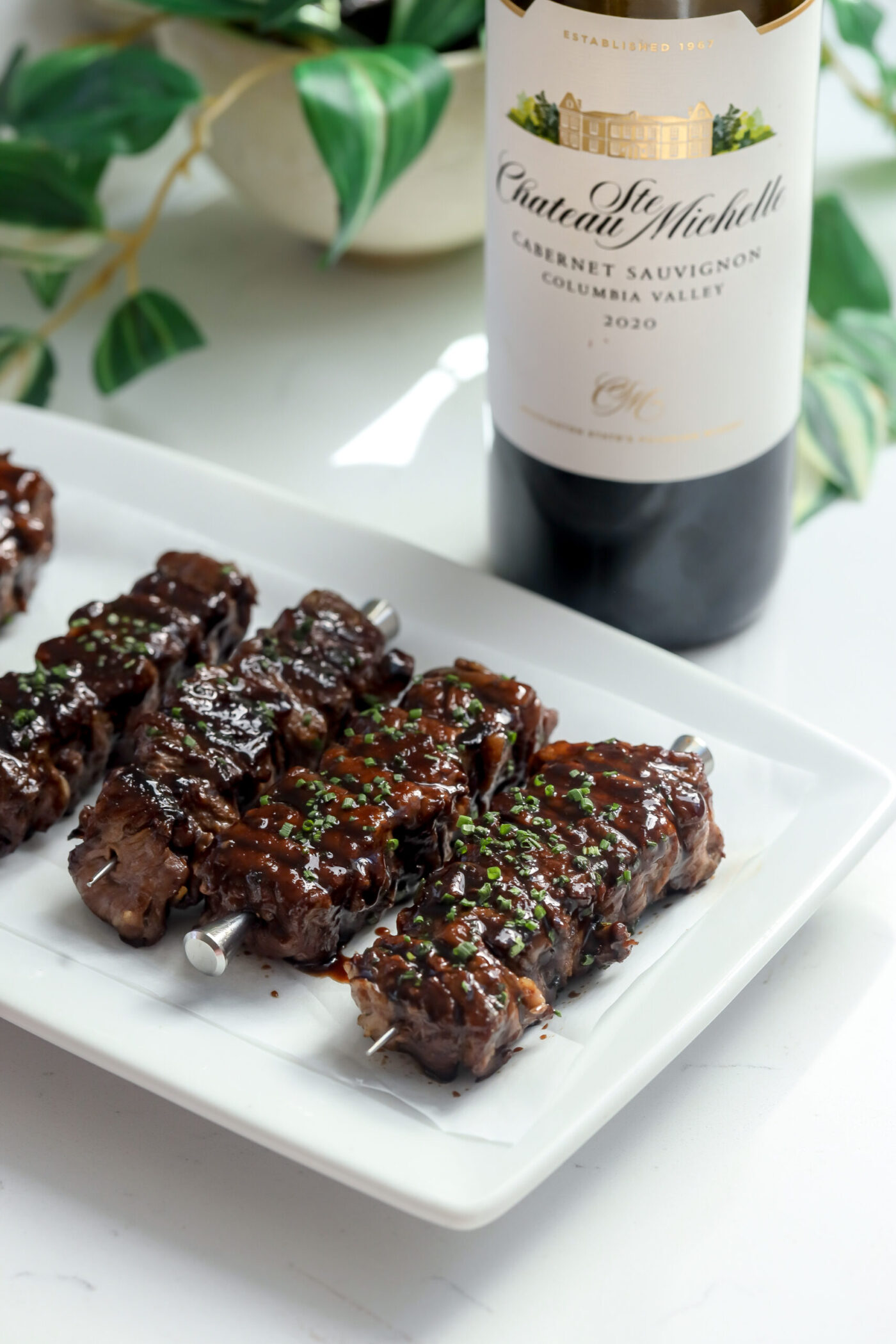 Ribeye Skewers that have been cooked perfectly covered in a wine and balsamic glaze.