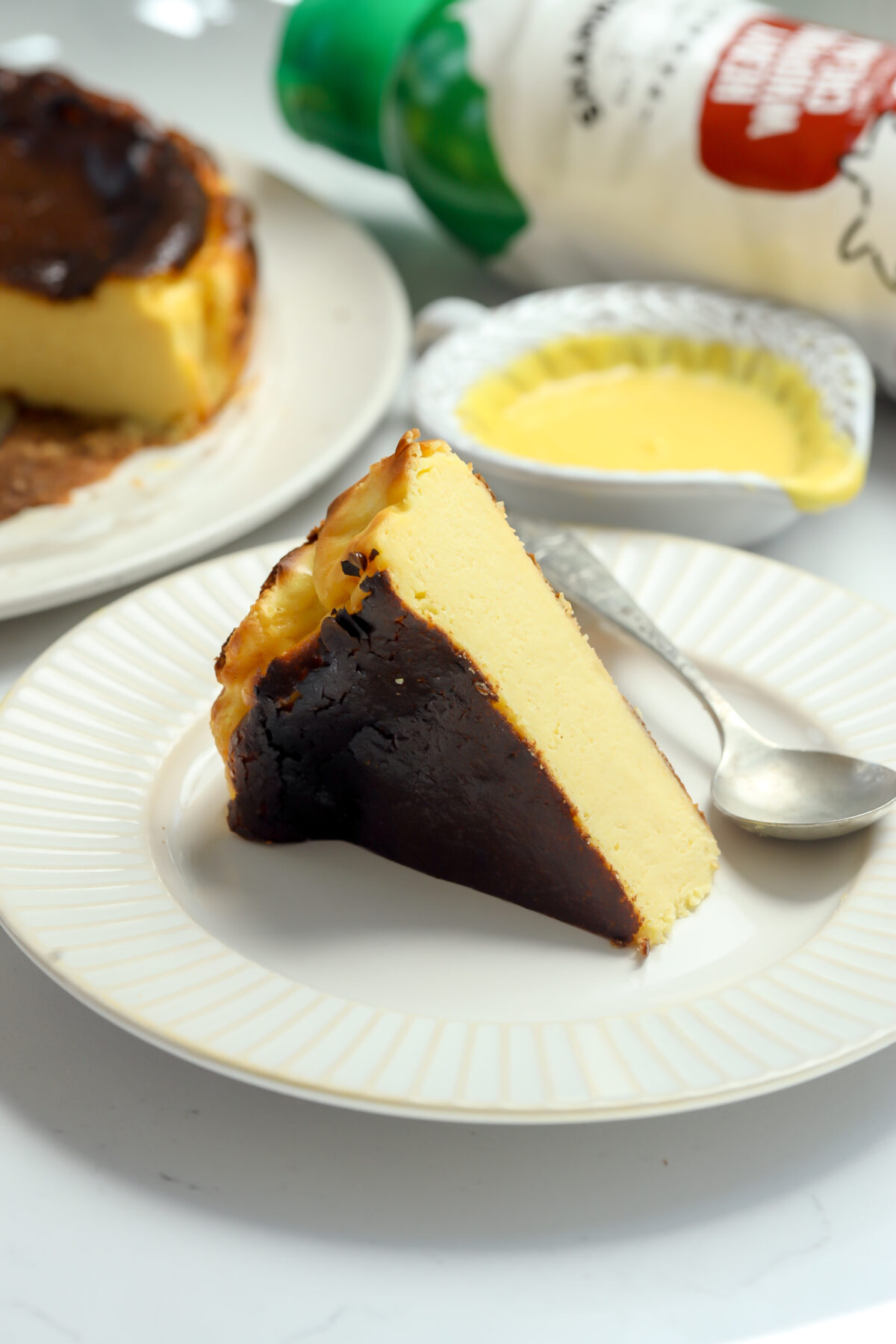 A slice of caramelized burnt Basque corn cheesecake with a creamy center.