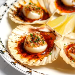 tender and juicy scallop coated in a spicy and sweet butter and then broiled to a golden perfection