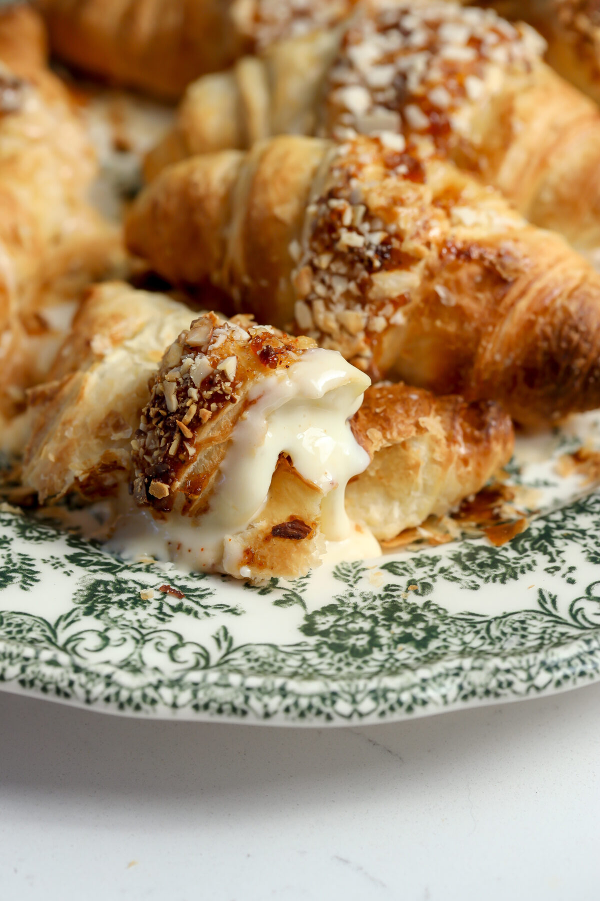 Croissants stuffed with fig jam and brie and baked in the oven.