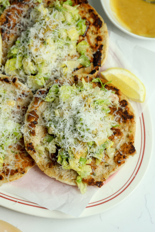A recipe for Chicken Smash tacos on pita bread with a dressing that gets baked in and topped with shredded lettuce.