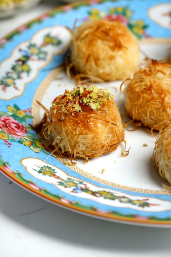 Straight of of the oven, crispy baked brie bites wrapped in phyllo dough and covered in butter.
