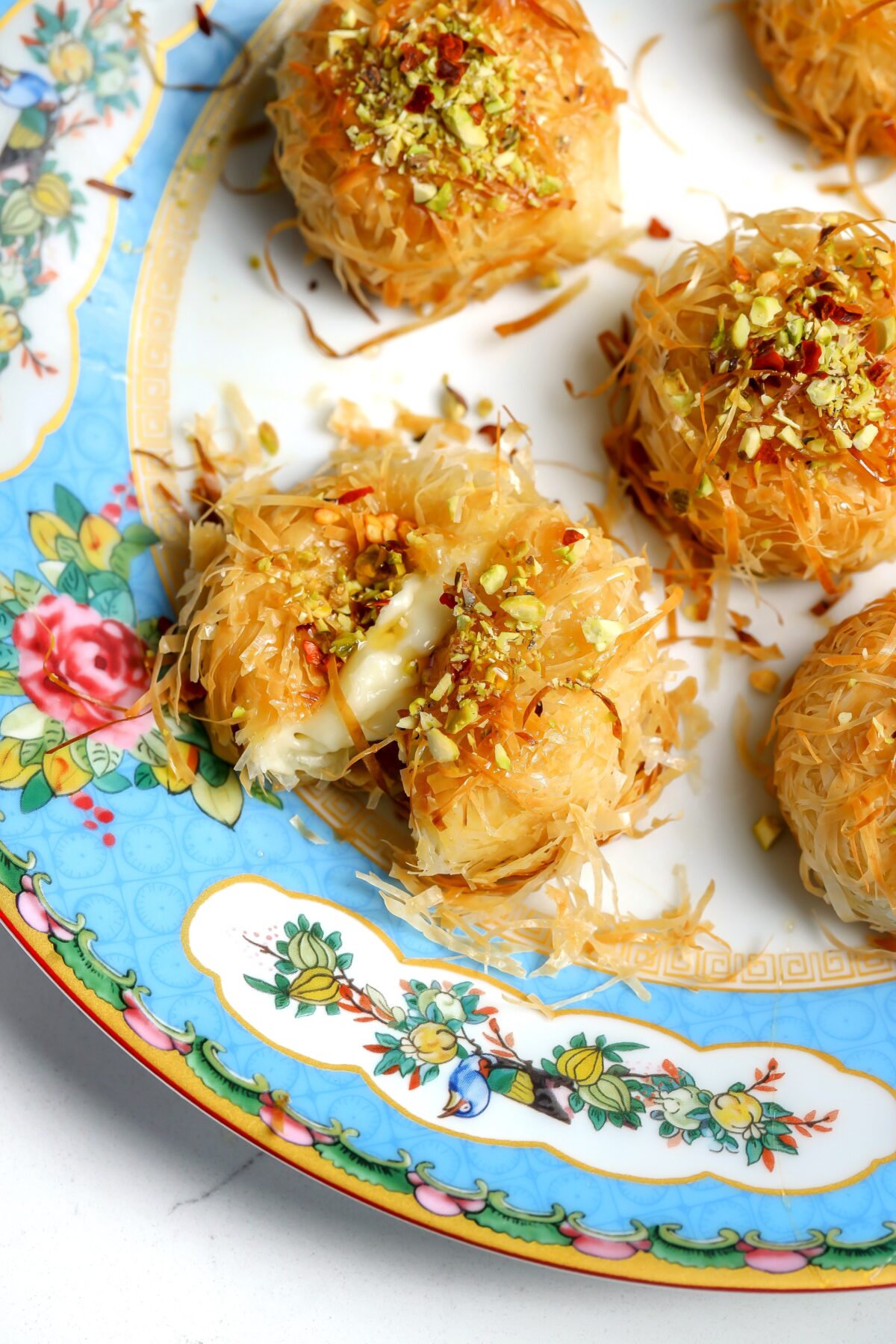 Straight of of the oven, crispy baked brie bites wrapped in phyllo dough and covered in butter.