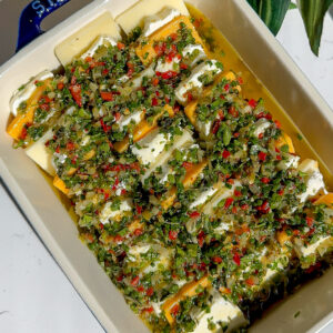 Marinated cheese with an herb oil spread top, this is an easy appetizer because it's fresh out of the fridge and cold.