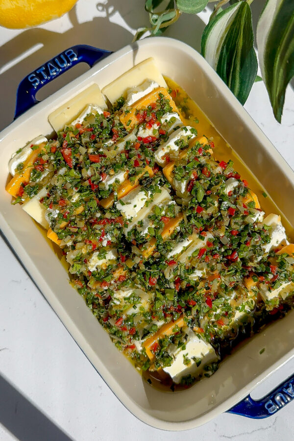 Marinated cheese with an herb oil spread top, this is an easy appetizer because it's fresh out of the fridge and cold.