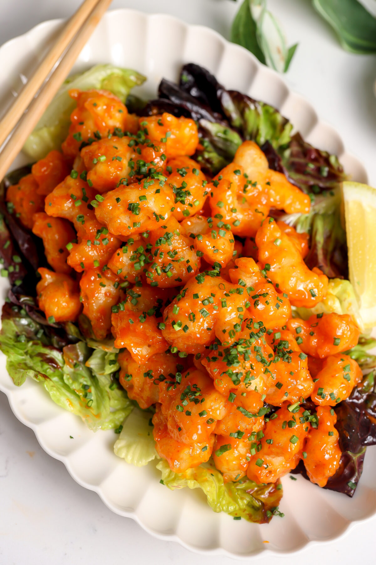 Crispy Rock Shrimp Tempura. a Nobu Style copy cat recipe with a delicious sauce sitting on a bed of yuzu salad.