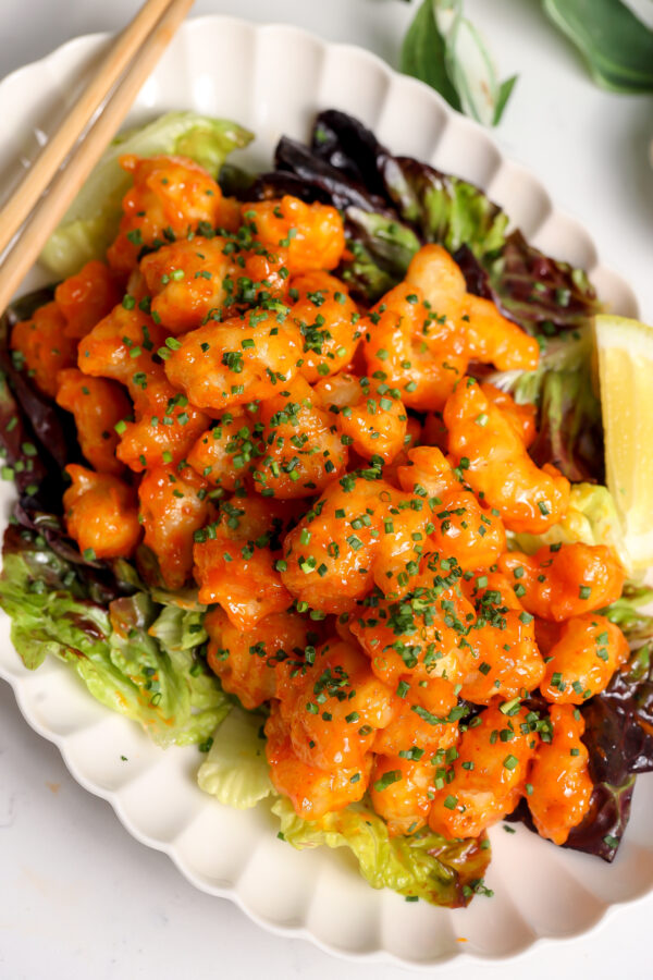 Crispy Rock Shrimp Tempura. a Nobu Style copy cat recipe with a delicious sauce sitting on a bed of yuzu salad.