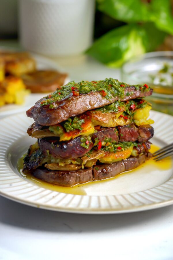 beef tenderloin grilled to perfection on a griddle and then layered in stacks with potatoes and chimichurri sauce.