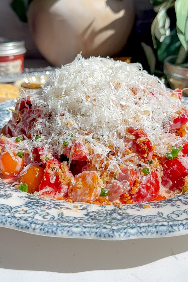 A delicious tomato salad covered in homemade ranch and pam cheese, a perfect summer recipe.