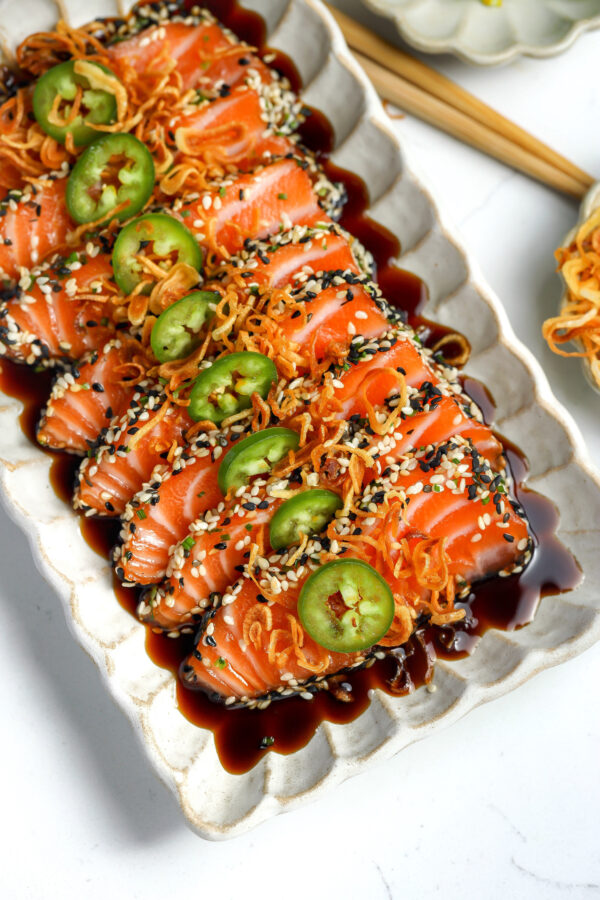 salmon crusted in sesame seeds and chives in a delicious sauce making this crudo amazing.
