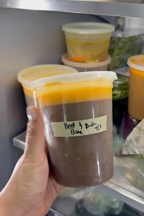 A recipe for a rich beef bone broth in a bowl.