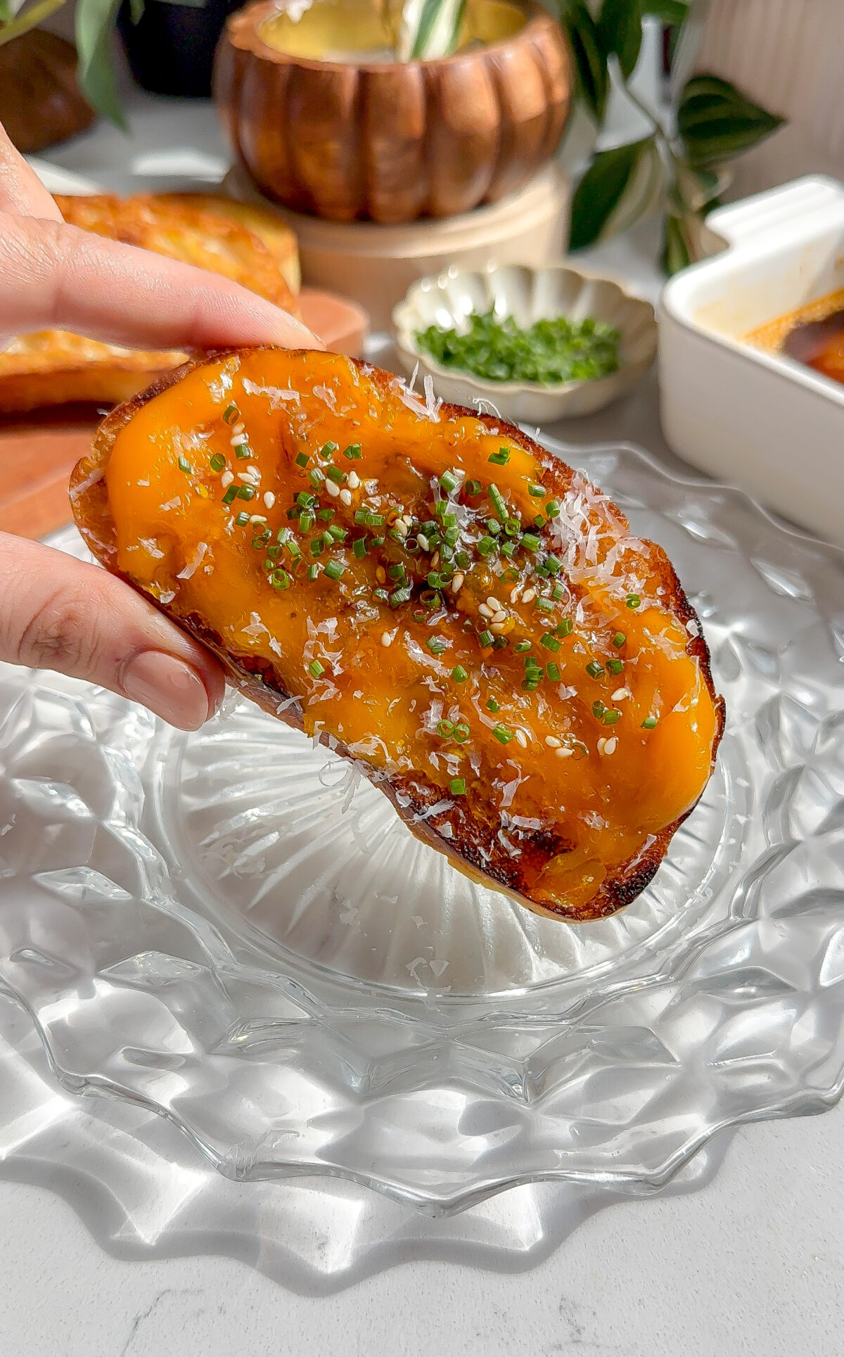 buttery, creamy, jammy spicy egg yolk recipe spread across ciabatta toast and topped with chives and parmesan.