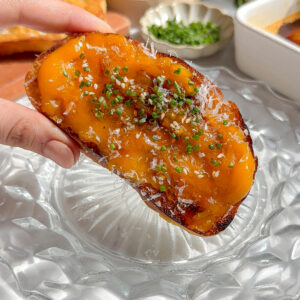 buttery, creamy, jammy spicy egg yolk recipe spread across ciabatta toast and topped with chives and parmesan.