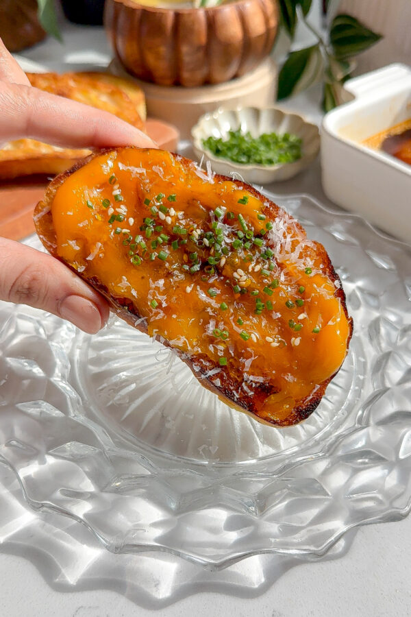 buttery, creamy, jammy spicy egg yolk recipe spread across ciabatta toast and topped with chives and parmesan.