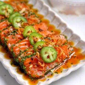 Chive-crusted salmon crudo with yuzu soy and spicy mayo — a fresh, elegant crudo appetizer recipe with crisp chives, jalapeño, and fried shallots.