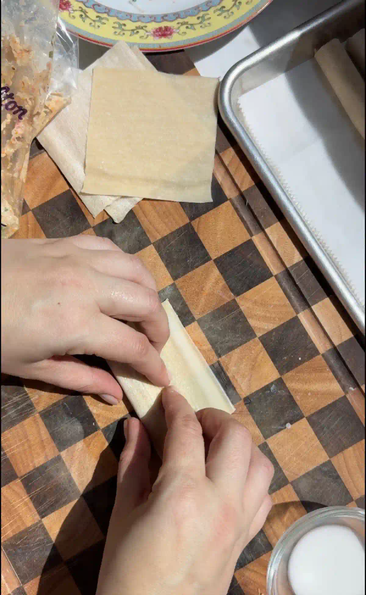 Beginning to roll the crab wontons into a taquitos.